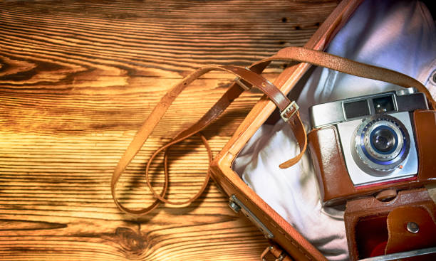 istock Old photo camera, travel concept 1012530946