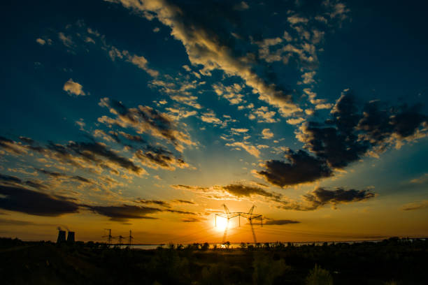 istock 750 kV line support against a beautiful sunset 1012531140
