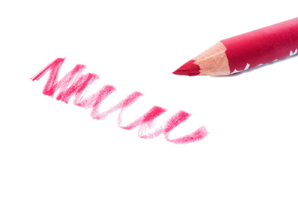 istock Cosmetic red lips pencil and shavings 1012531500