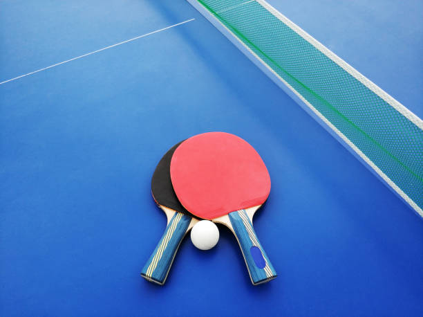 istock Ping-pong rackets and ball 1012534324