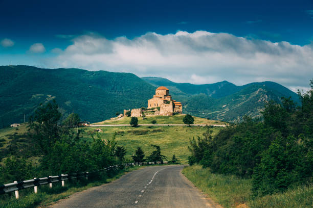 mtskheta, georgia. road going to jvari, ancient orthodox monastery, world heritage by unesco. mountain landscape and ancient temple - mtskheta imagens e fotografias de stock