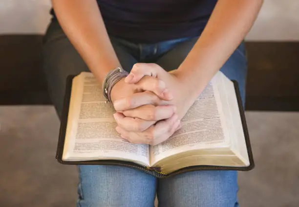 Photo of Young Teenage Girl Studying the Bible Outside