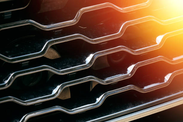 Grid of car with sunflare Grid of car with sunflare. Radiator grille. Metal close-up texture background. Chrome grill of big powerful engine macro radiator grille stock pictures, royalty-free photos & images