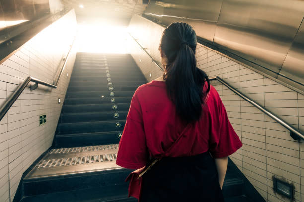 istock Woman walking up stairs 1012542068
