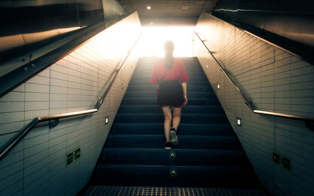 istock Woman walking up stairs 1012542124
