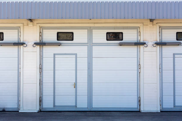 istock Grey and white garage door with windows 1012542176