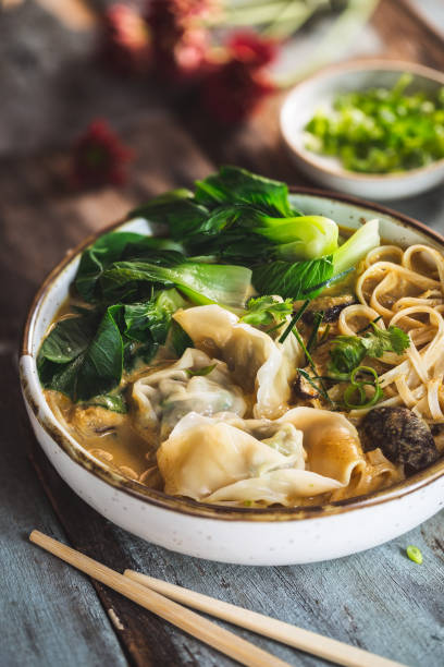 istock Noodle Soup with Yellow Curry and Chinese Ravioli (Wontons) 1012542188