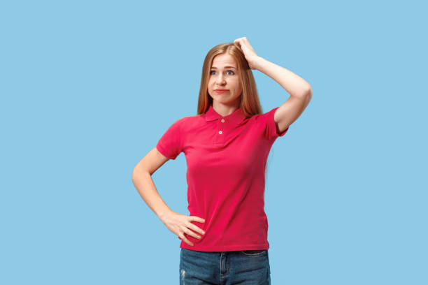 istock Young serious thoughtful business woman. Doubt concept 1012548780