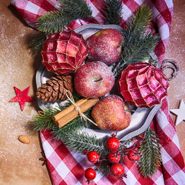 istock Christmas background, top view, apples on the lintage plate 1012549138