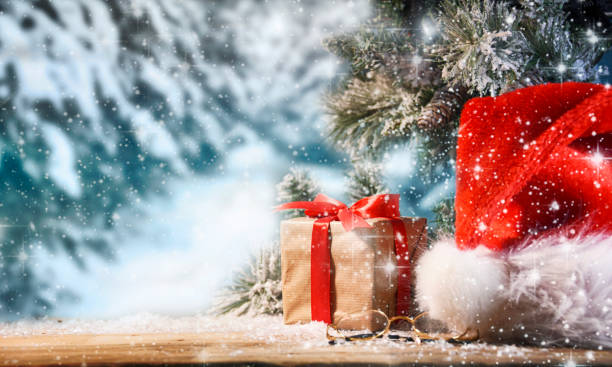 istock Winter Christmas background with Santas hat 1012560448