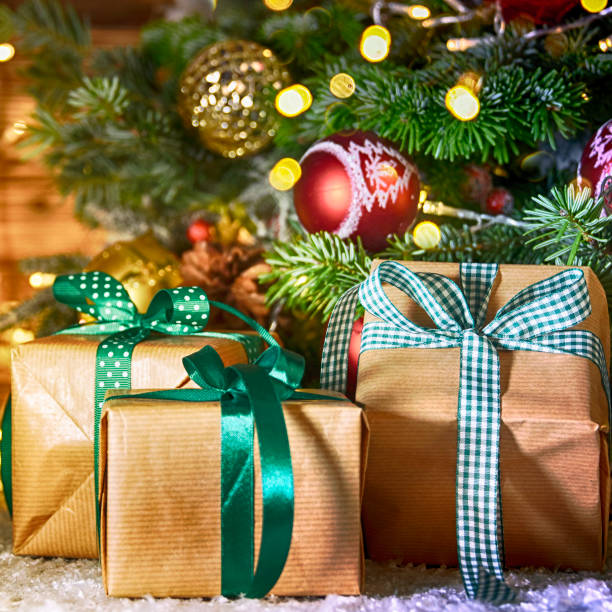 istock Christmas treewith gifts, rustic background 1012562136