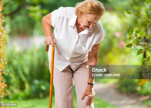 Elderly Woman With A Walking Stick Stock Photo - Download Image Now - Senior Adult, Pain, Walking