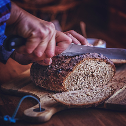 Cutting Fresh Homemade Brown Bread