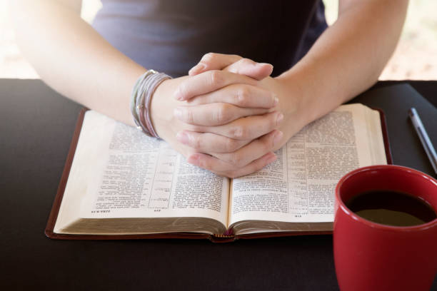 istock Young Person Studing the Bible and Praying 1012577428