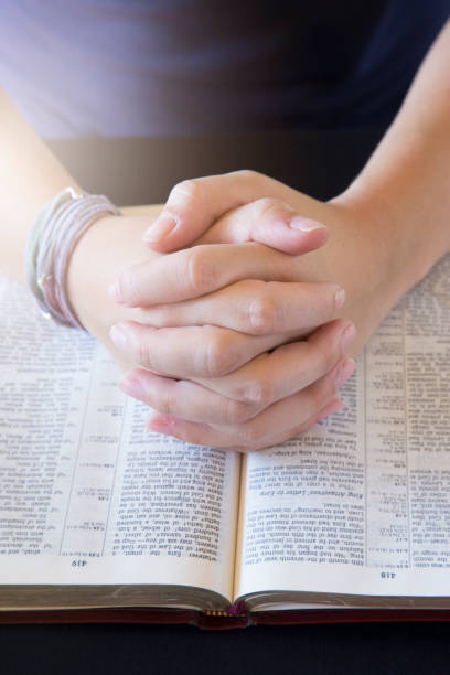 istock Young Person Studing the Bible and Praying 1012577732