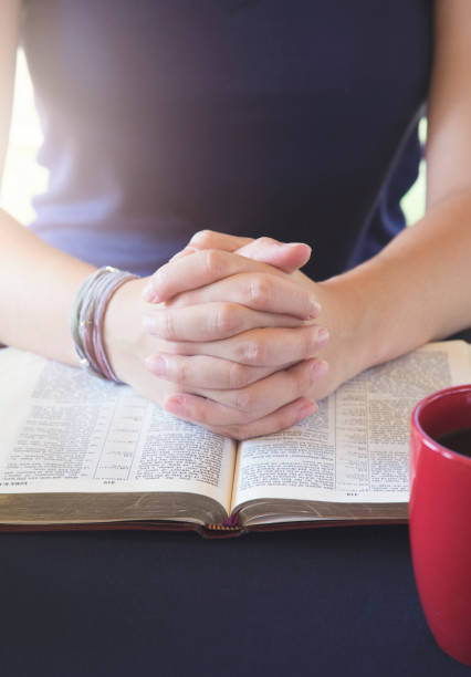 istock Young Person Studing the Bible and Praying 1012577738