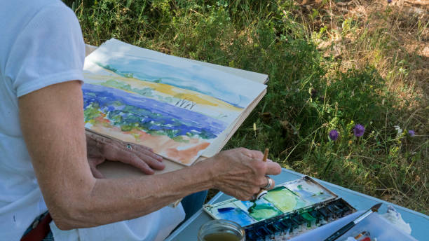 istock Painting with water colours 1012580560
