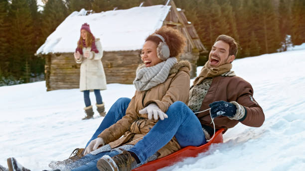 istock Man and woman riding snow sledge 1012585570