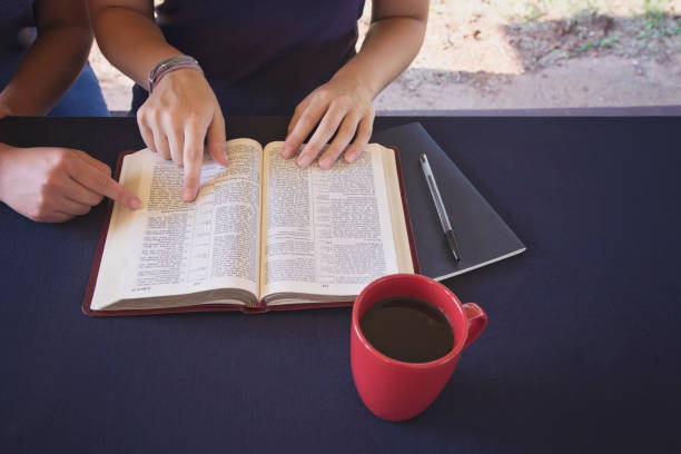 istock A Friend Helping Someone Study the Bible 1012586638