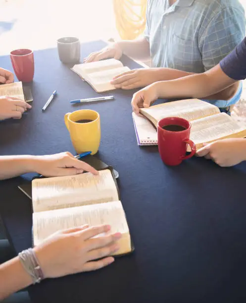 Photo of A Group of People Studying the Bible Outside