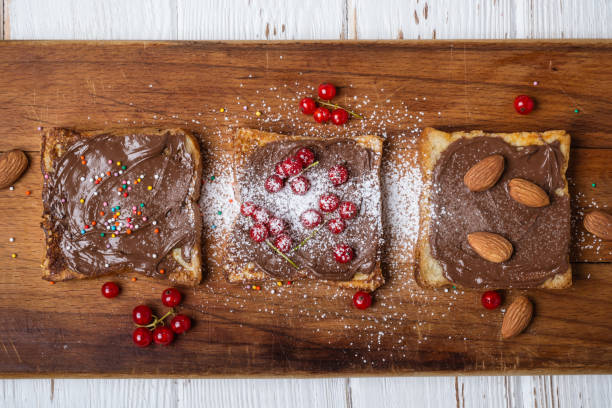 istock Fried toasts with chocolate cream, nuts and berries 1012613450