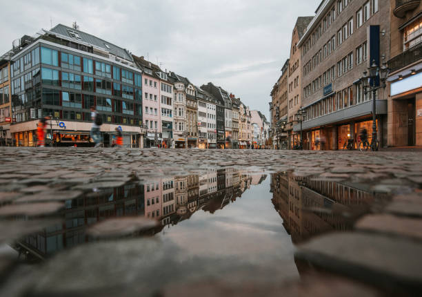 Street and reflection on puddle Street and reflection on puddle. Bonn, Germany bonn photos stock pictures, royalty-free photos & images