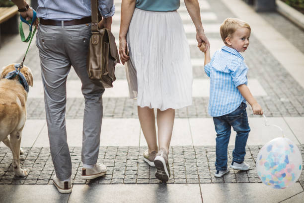 istock Family walking dog 1012622558