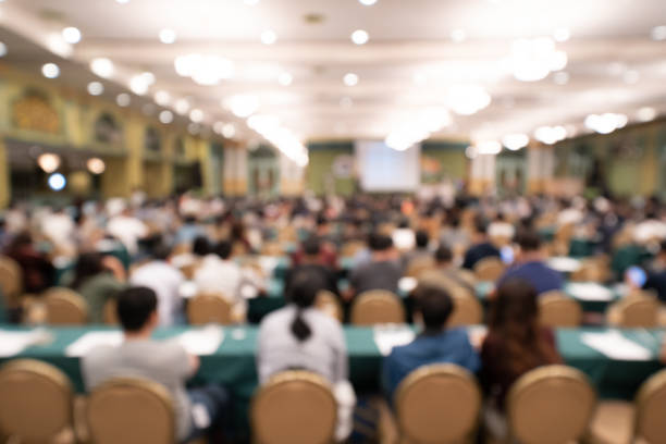 Blurred background of audience in the conference hall or seminar stock photo