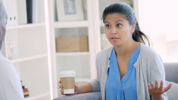 istock Serious woman talking with therapist 1012627898