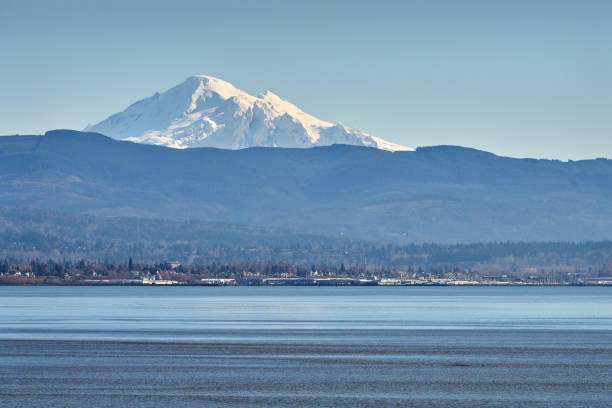 Mt Baker across Bellingham Bay, Washington Mount Baker rising up behind Bellingham Bay in Washington State. mt baker stock pictures, royalty-free photos & images