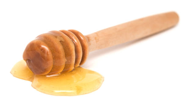 istock Wooden honey dipper 1012634502