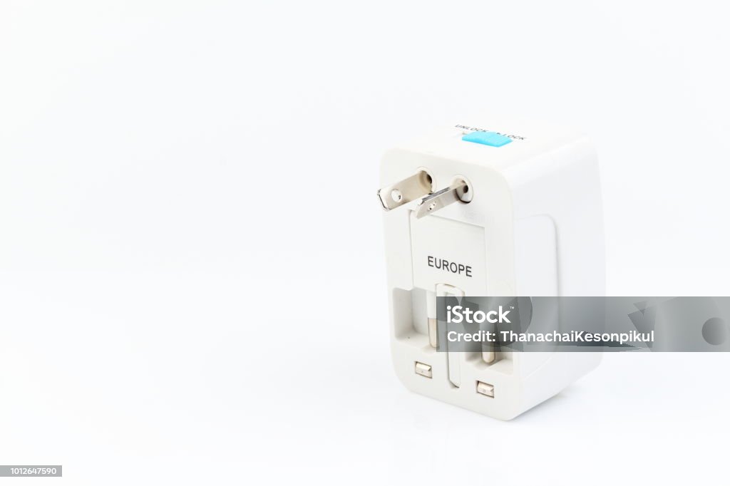 Universal travel adapter plug. isolated on white background. For travelers to many countries. Need a power adapter for electrical appliances. Universal travel adapter plug. isolated on white background. For travelers to many countries. Need a power adapter for electrical appliances.Universal travel adapter plug. isolated on white background. For travelers to many countries. Need a power adapter for electrical appliances. Appliance Stock Photo