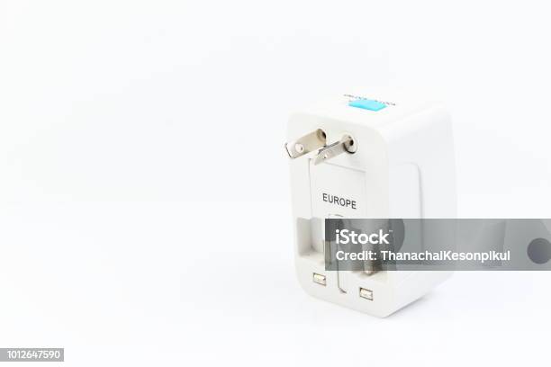 Universal Travel Adapter Plug Isolated On White Background For Travelers To Many Countries Need A Power Adapter For Electrical Appliances Stock Photo - Download Image Now
