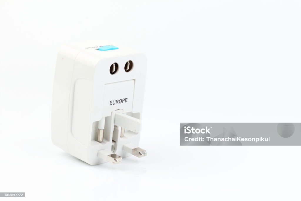 Universal travel adapter plug. isolated on white background. For travelers to many countries. Need a power adapter for electrical appliances. Appliance Stock Photo