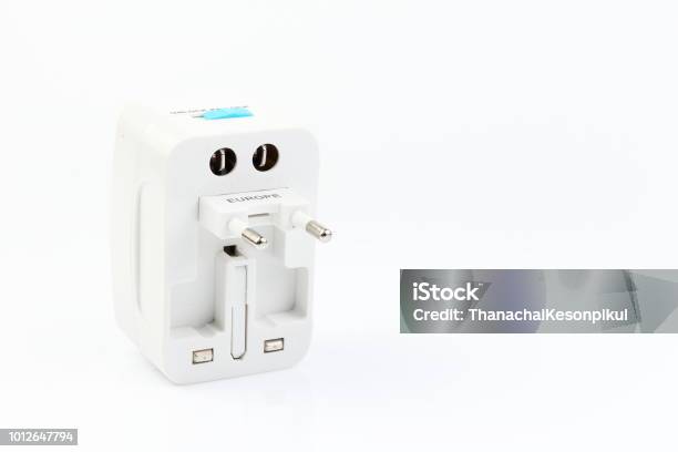 Universal Travel Adapter Plug Isolated On White Background For Travelers To Many Countries Need A Power Adapter For Electrical Appliances Stock Photo - Download Image Now