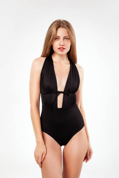 istock Beautiful woman in black monokini 1012651752