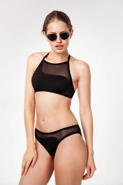 istock Beautiful woman in black bikini 1012651778