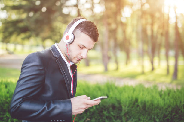 istock Attractive young man with headsets are going to work place. 1012651966