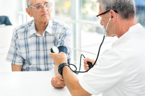 istock Doctor taking senior man's blood pressure 1012654590
