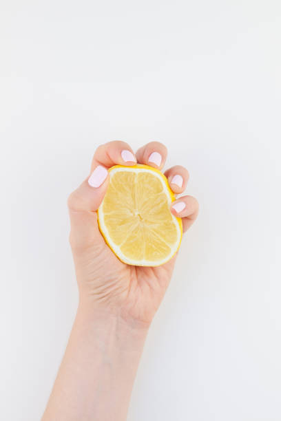 istock Woman hand with lemon 1012660798