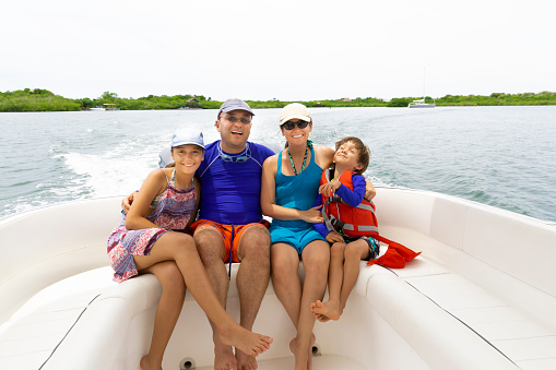 Lovely Family Enjoying Having Fun in a Boat