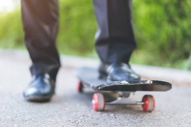 istock Businessman riding skateboard to work 1012671588