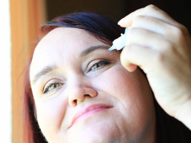 istock mature woman with eye drops 1012679382