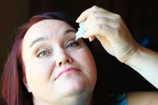 istock mature woman with eye drops 1012679396