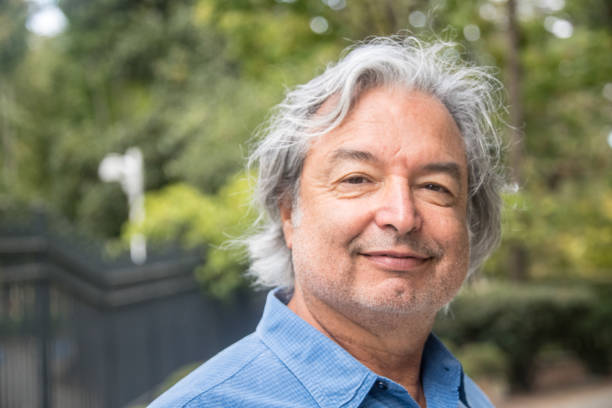 istock Smiling senior man with long white hair 1012679876