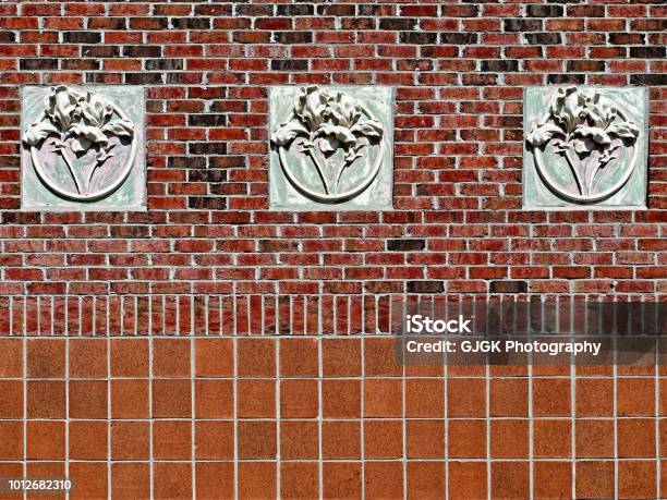 Concrete 3 Flowers On Red Brick Wall Stock Photo - Download Image Now - Tulane University, Abstract, Architecture