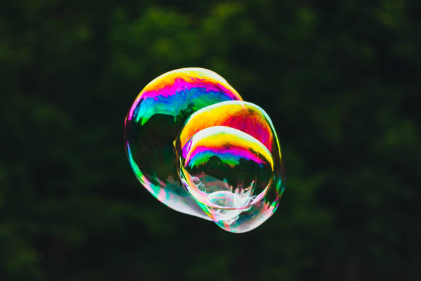 istock soap bubbles on green nature background 1012687668