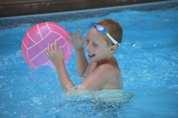 istock Boy in a Swimming Pool 1012695748