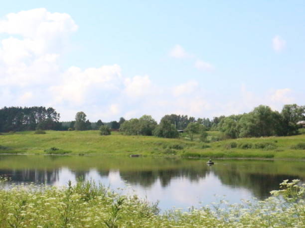 istock summer village landscape with large clouds 1012699126