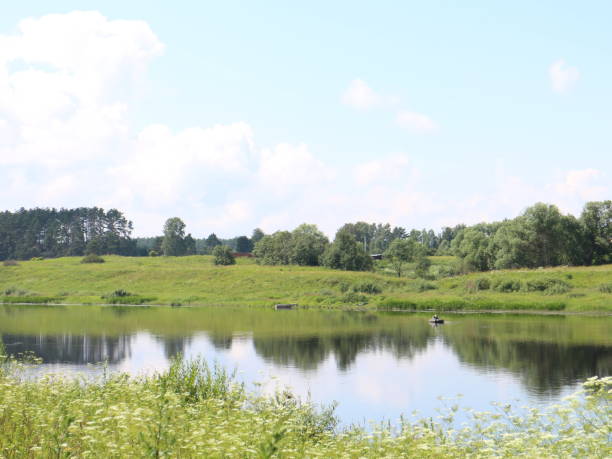 istock summer village landscape with large clouds 1012699132